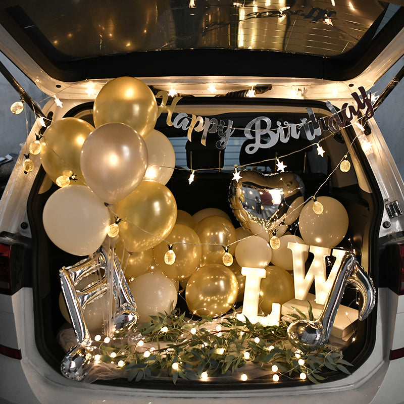 Car trunk surprise with music notes and string lights