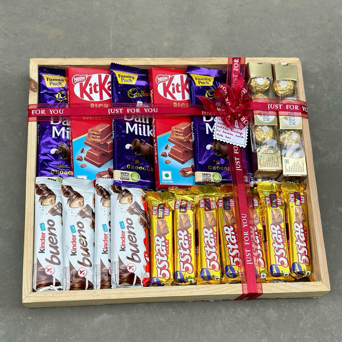 Large wooden tray hamper filled with assorted chocolates