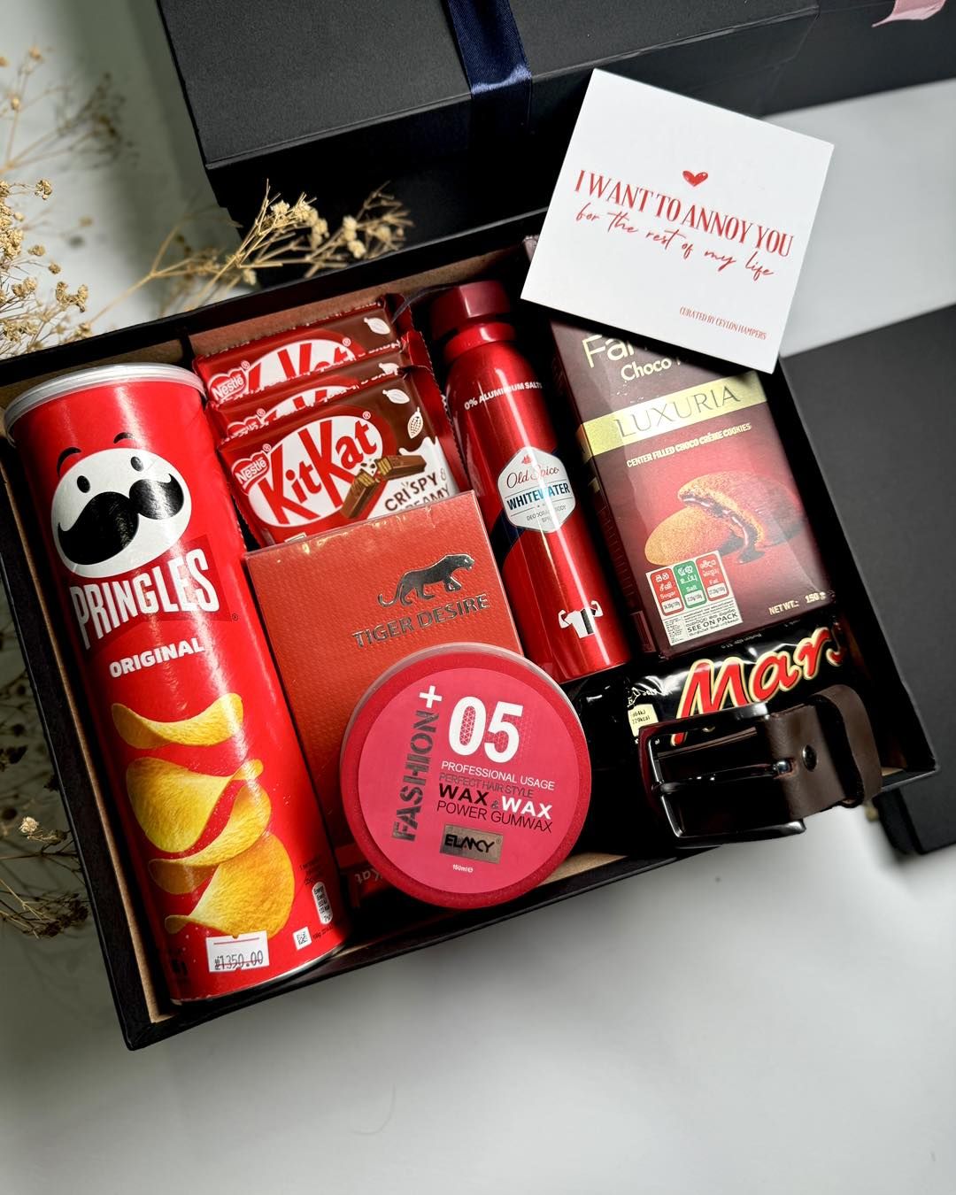 Men's personalized gift box with snacks, grooming products, and chocolates