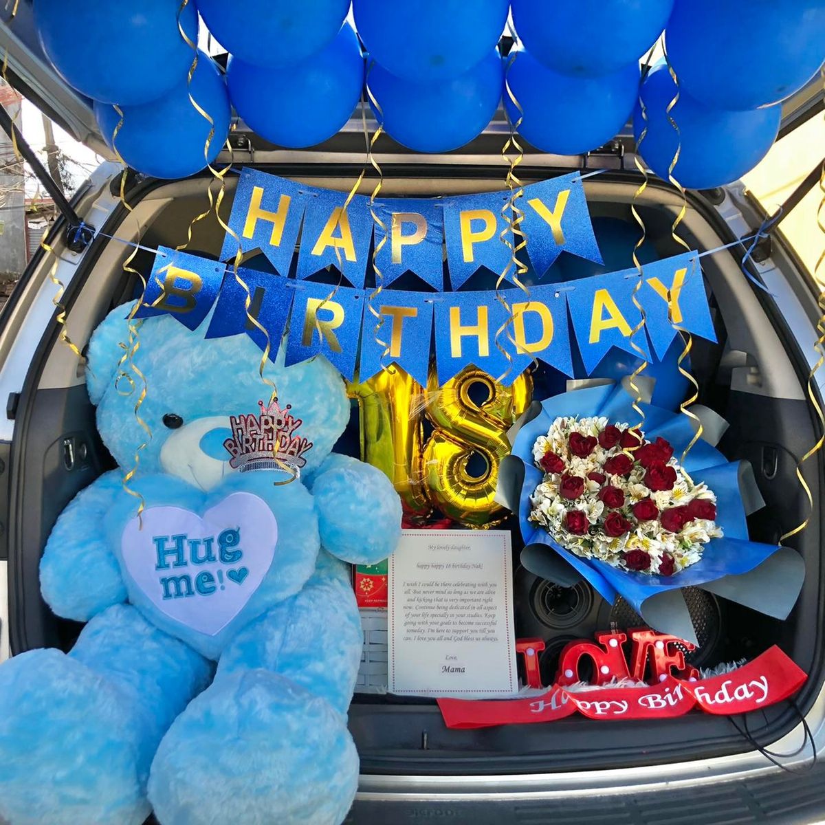 Blue themed car trunk surprise with large teddy bear